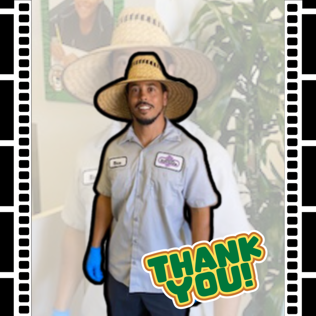 Text: Thank you Photo: Employee standing in front of tree